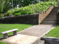 Rotting railroad ties before retaining wall construction